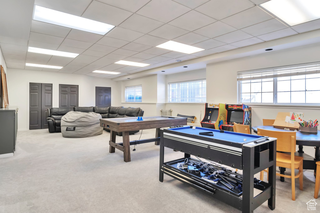 Rec room featuring billiards, light carpet, plenty of natural light, and a drop ceiling