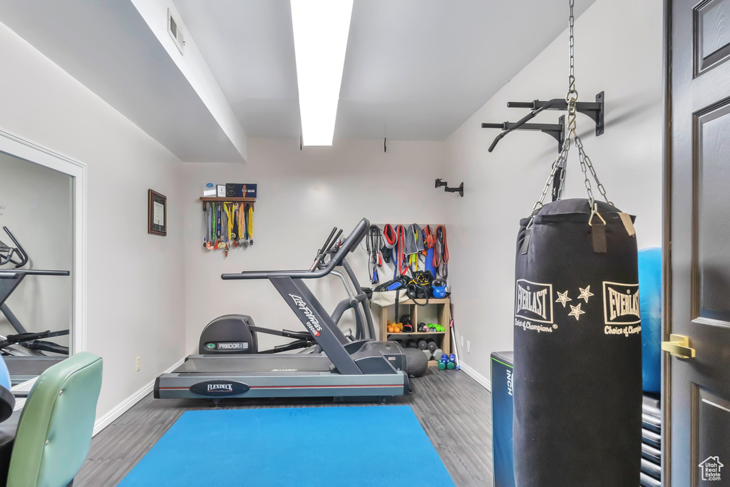 Exercise room with wood-type flooring