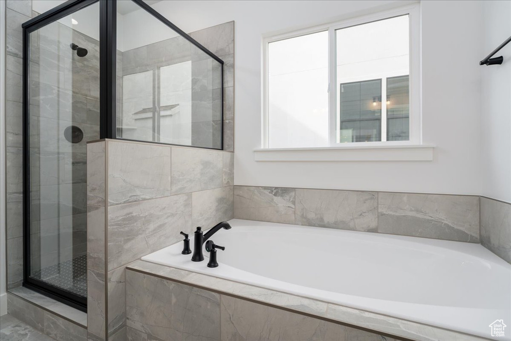 Bathroom featuring separate shower and tub