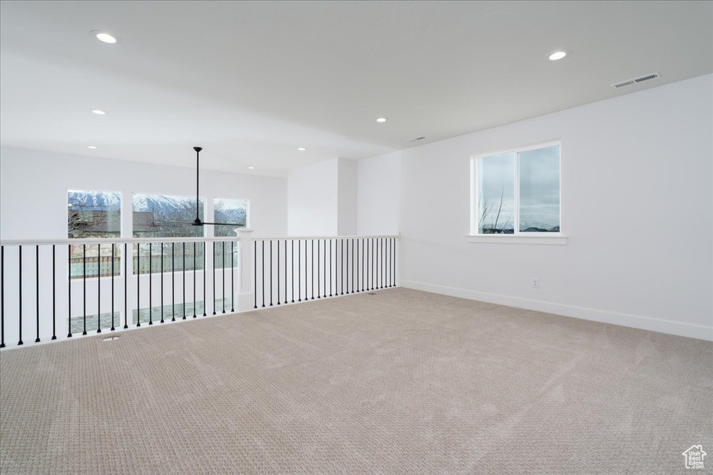 Spare room featuring light colored carpet