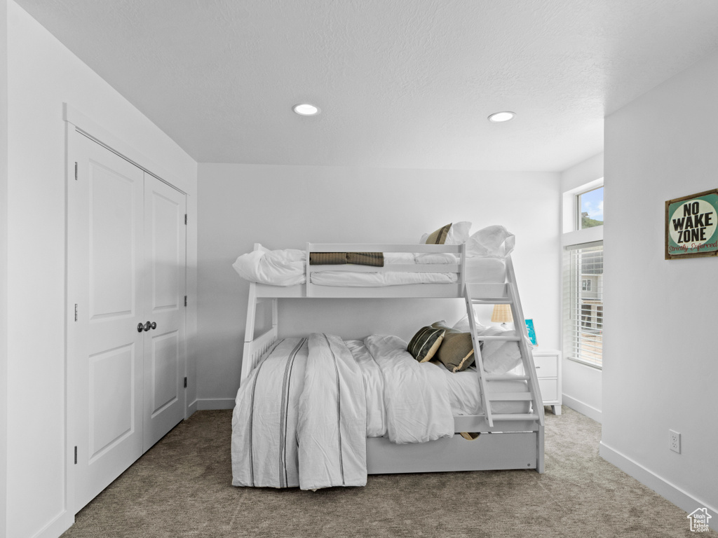 Bedroom with a closet and carpet