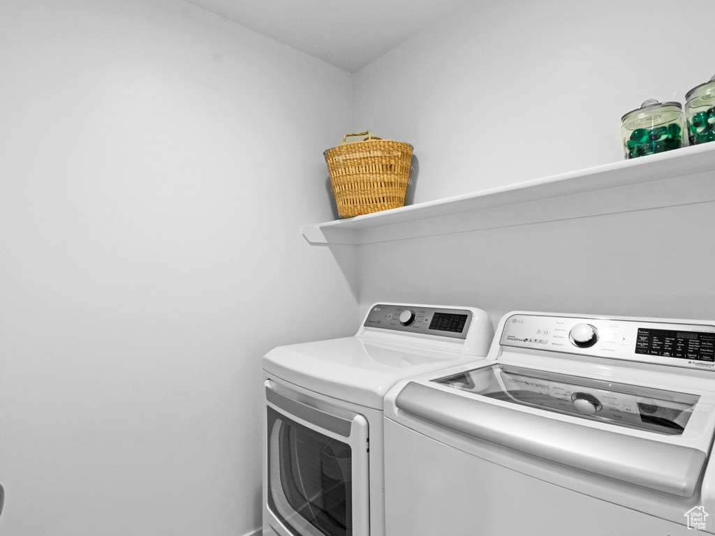 Laundry room featuring separate washer and dryer