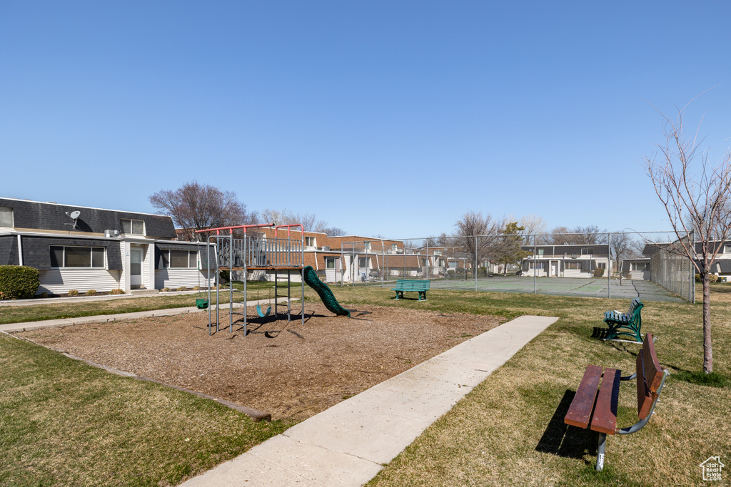 View of play area featuring a yard