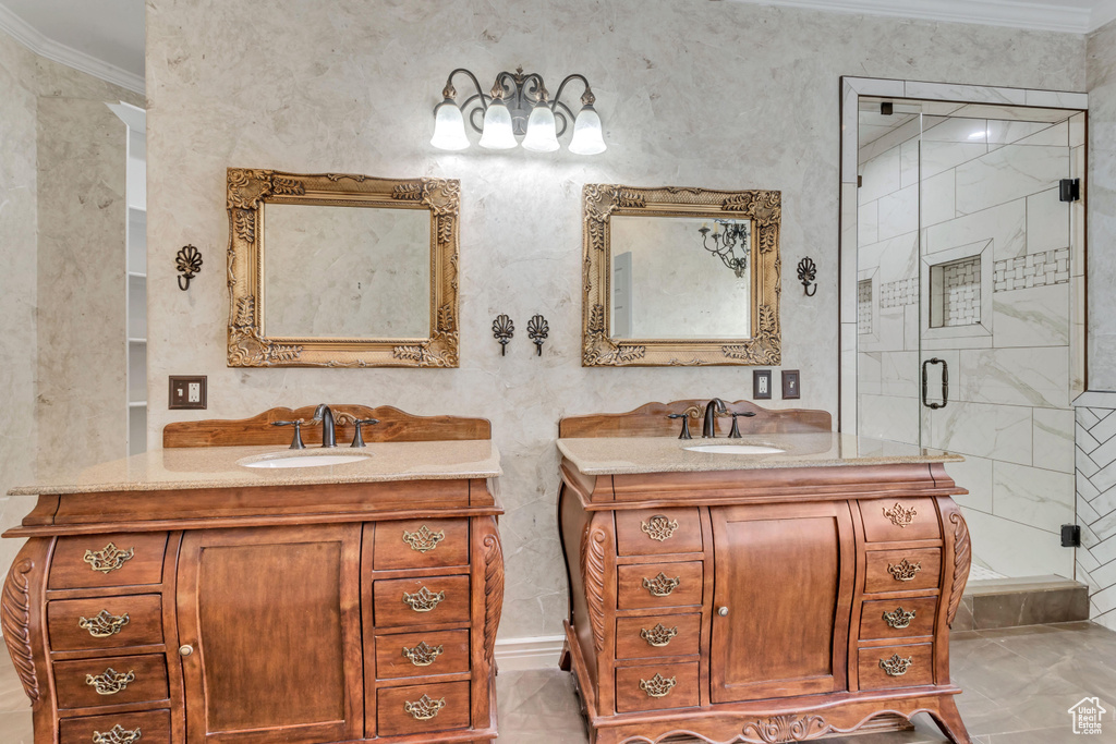 Bathroom featuring an enclosed shower, tile flooring, crown molding, and vanity