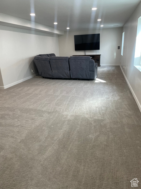 Unfurnished living room featuring light colored carpet