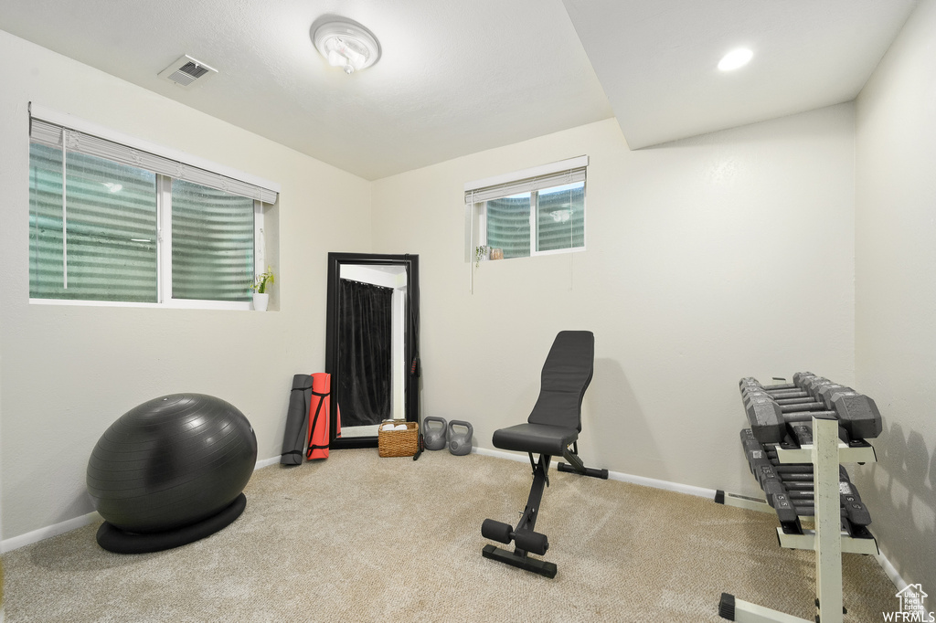Exercise area with light colored carpet