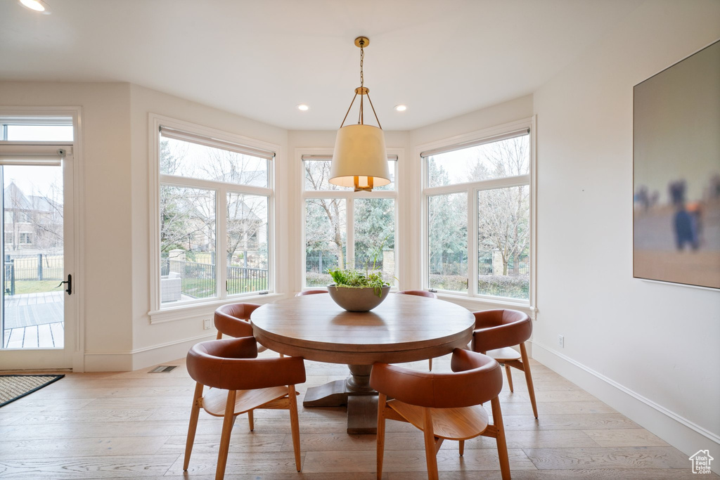 Dining space featuring light hardwood / wood-style flooring and plenty of natural light