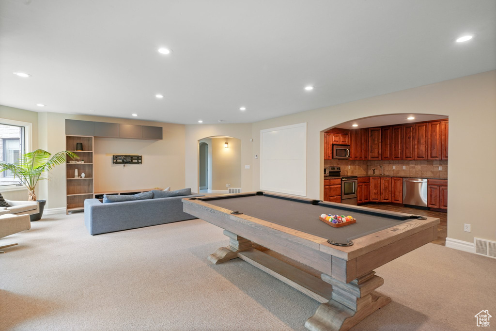 Recreation room featuring billiards and light colored carpet