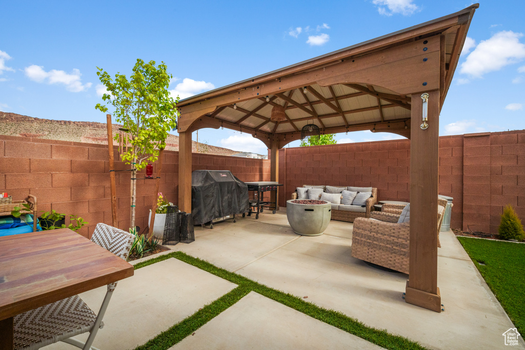 View of terrace with an outdoor living space, a gazebo, and area for grilling