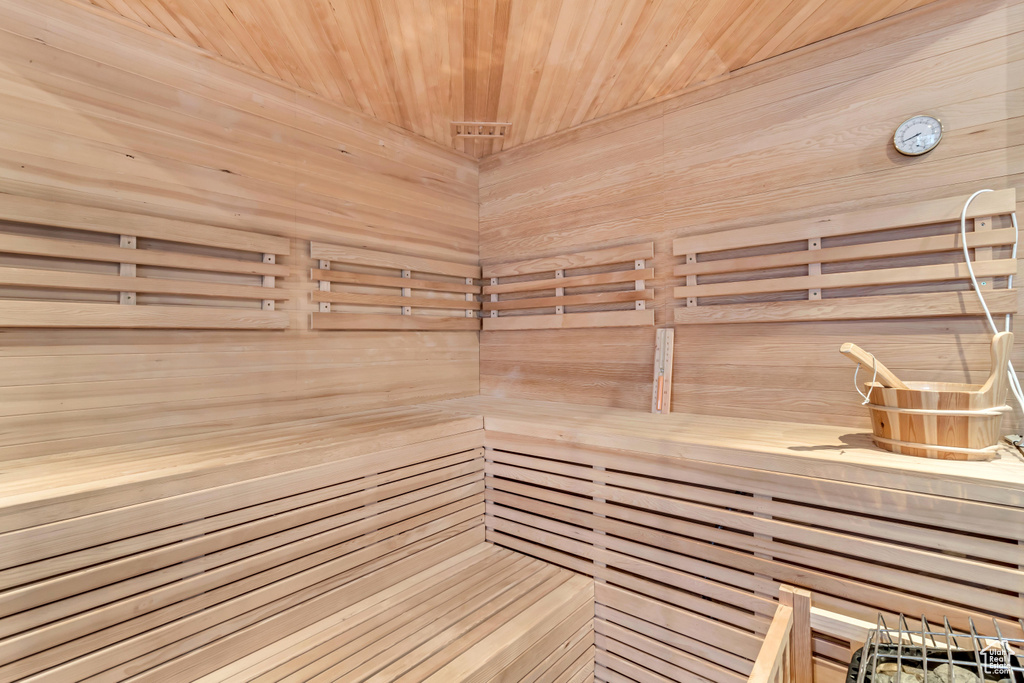 View of sauna / steam room with wooden walls