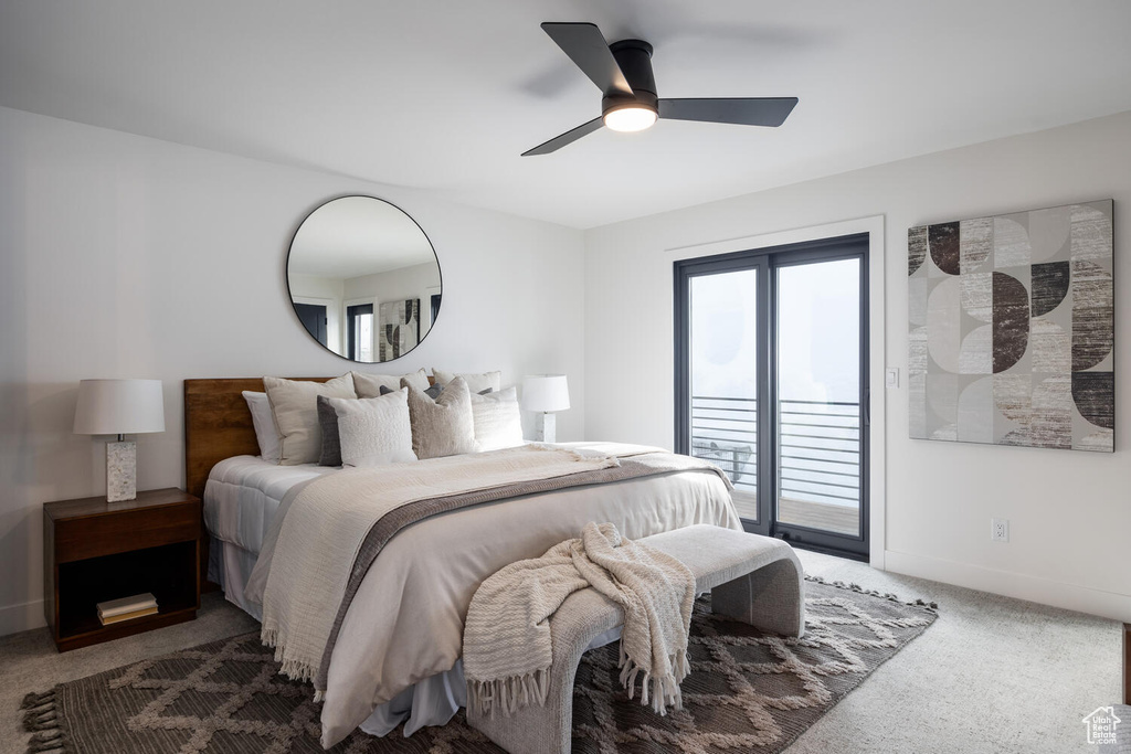 Carpeted bedroom featuring ceiling fan and access to outside