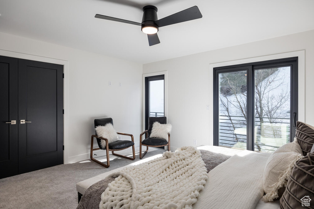 Bedroom with ceiling fan and carpet floors