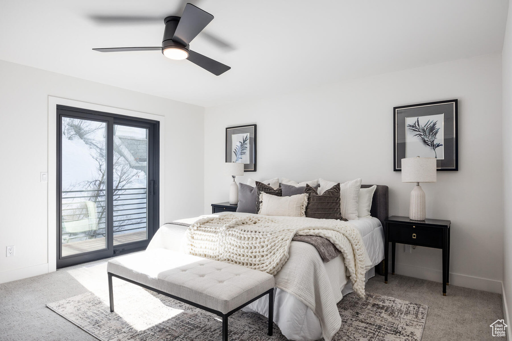 Carpeted bedroom with ceiling fan and access to outside