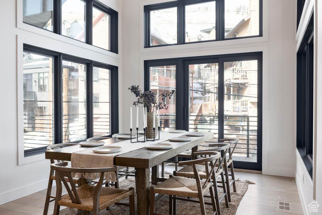 Dining area with light hardwood / wood-style floors