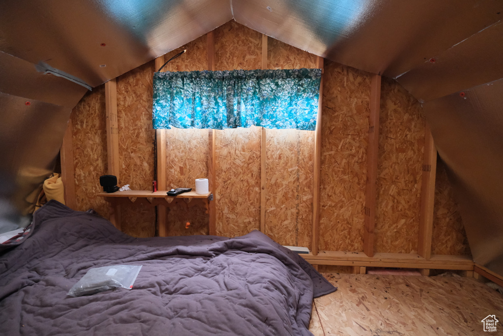 Bedroom with lofted ceiling
