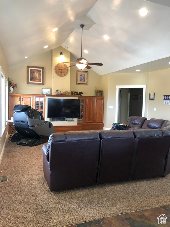 Living room with ceiling fan, lofted ceiling, and tile flooring