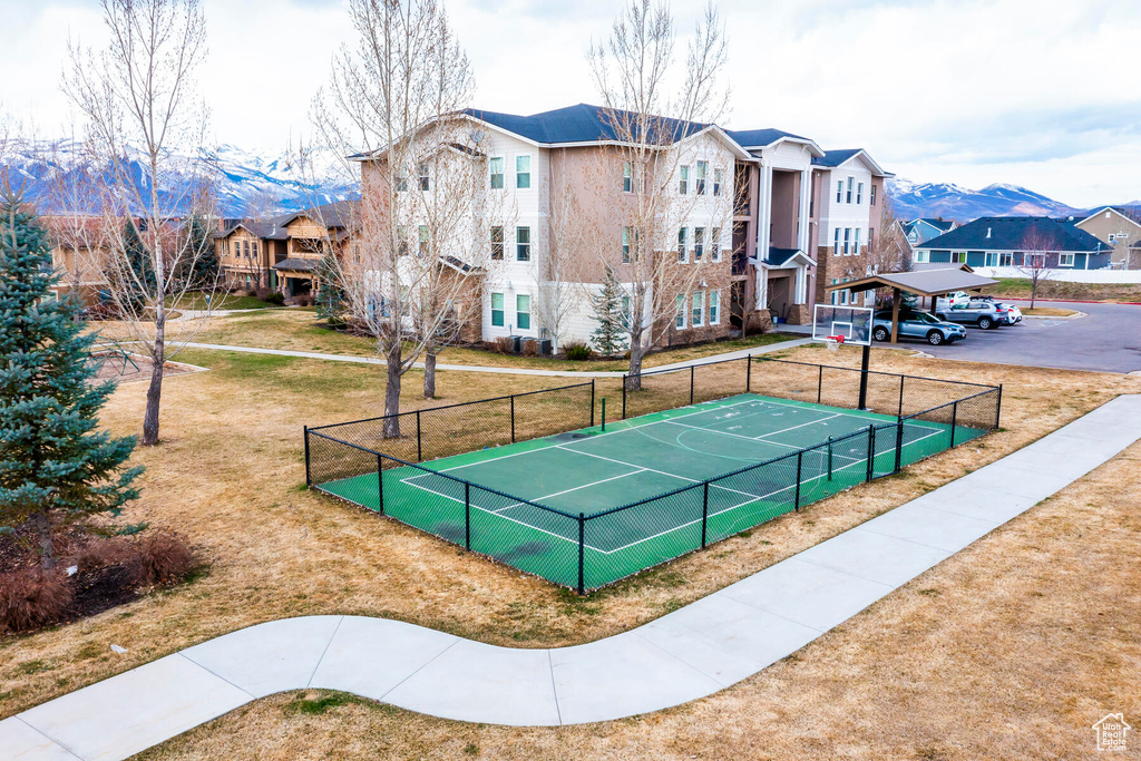 Surrounding community featuring a mountain view and tennis court