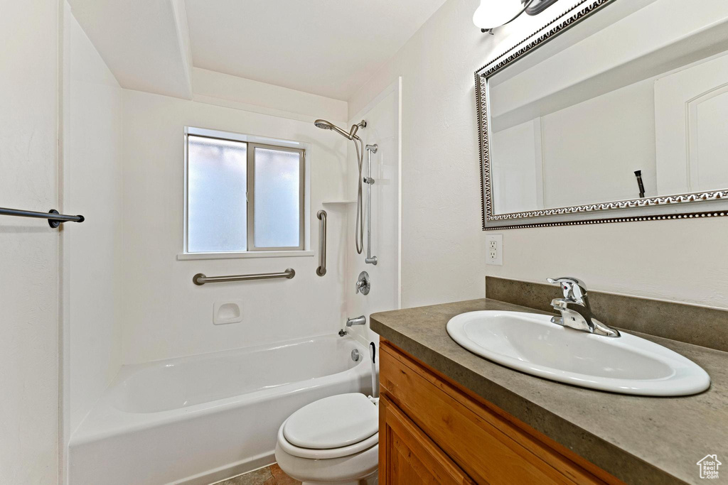Full bathroom featuring shower / washtub combination, oversized vanity, and toilet
