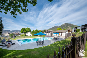 View of swimming pool featuring a mountain view and a patio