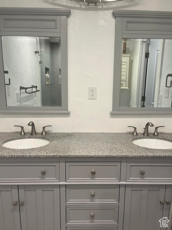 Bathroom featuring dual bowl vanity
