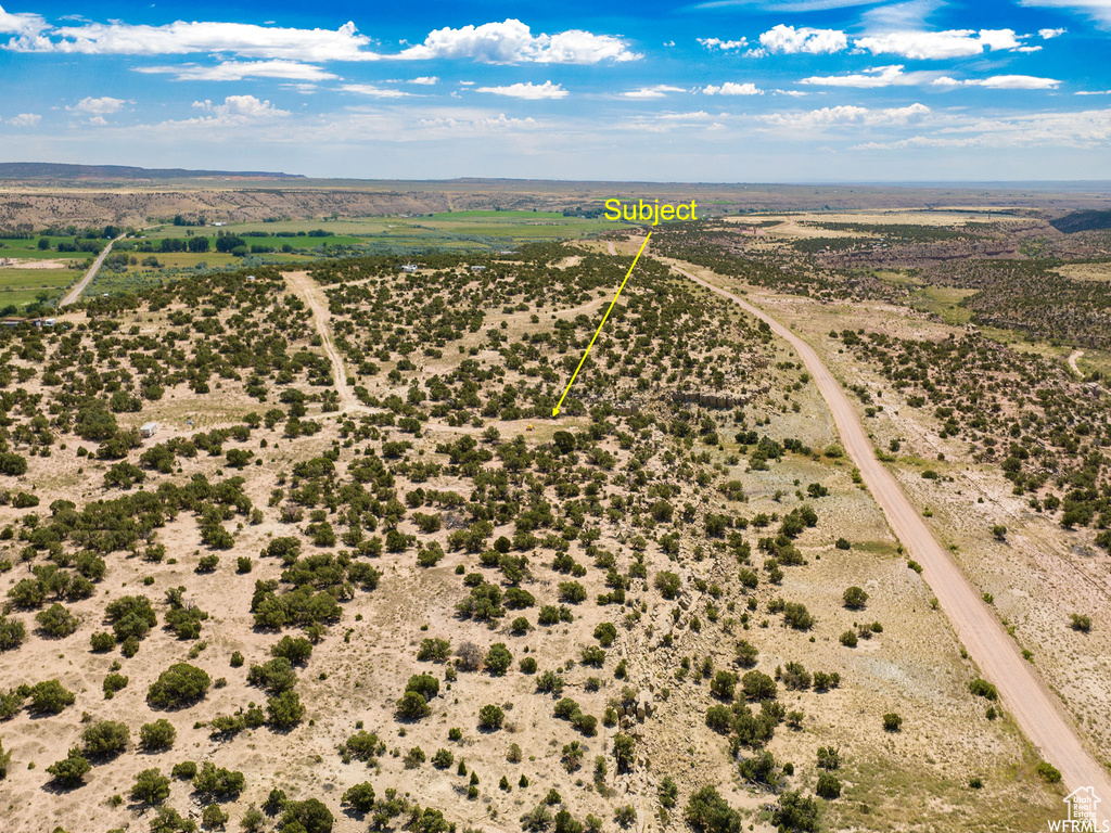 Birds eye view of property with a rural view