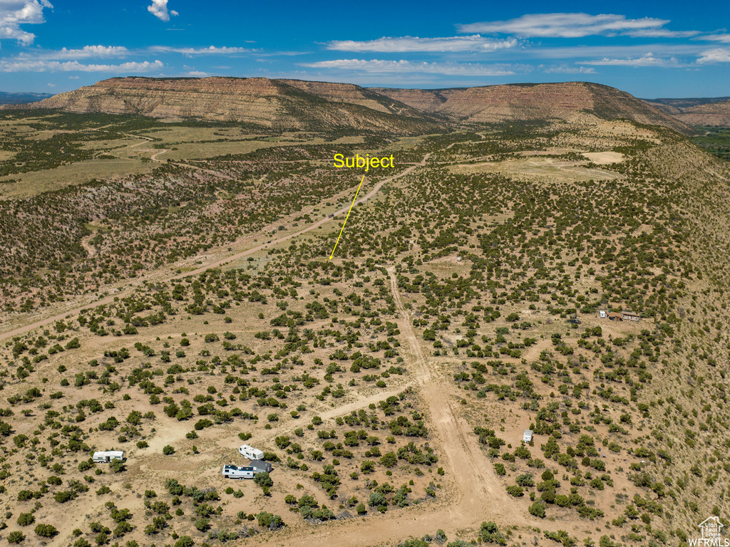 Birds eye view of property with a mountain view