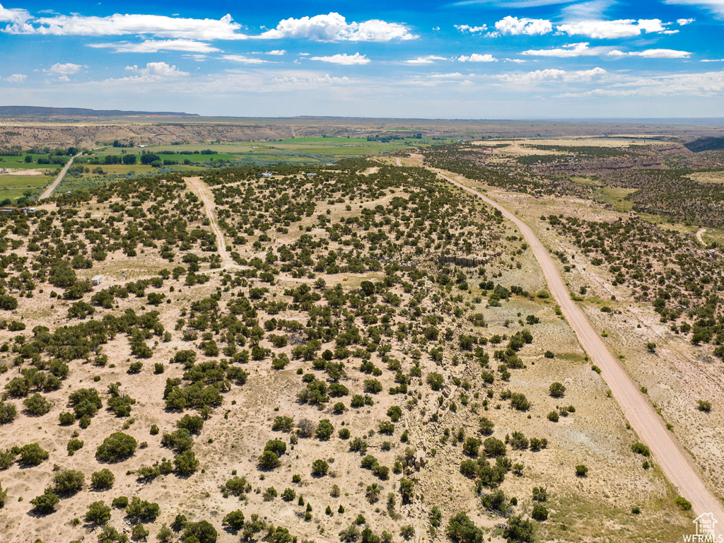 Birds eye view of property featuring a rural view