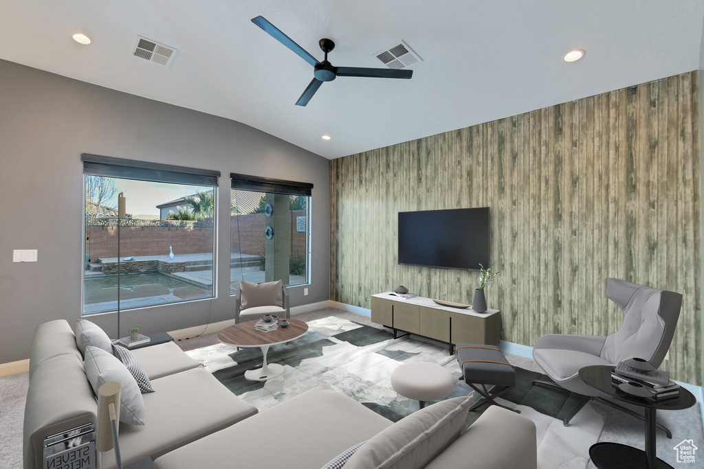 Living room featuring lofted ceiling and ceiling fan