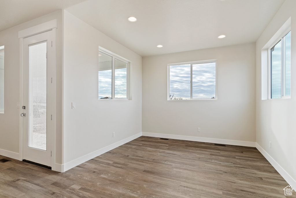 Unfurnished room featuring hardwood / wood-style flooring