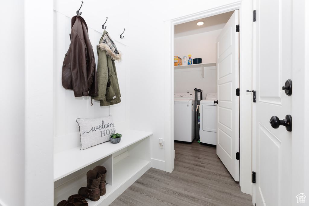 Mudroom featuring light hardwood / wood-style floors and separate washer and dryer