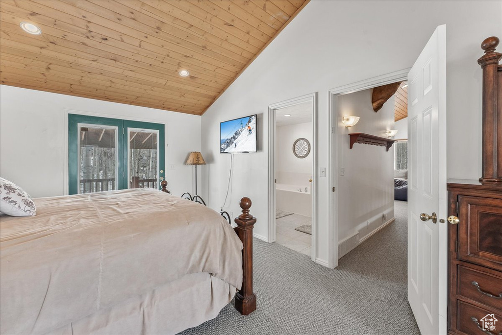 Bedroom featuring ensuite bathroom, wooden ceiling, lofted ceiling, light colored carpet, and access to outside
