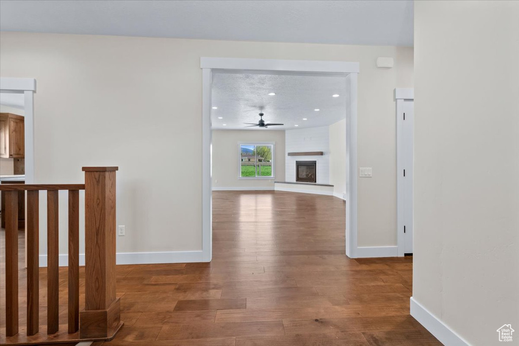 Corridor featuring hardwood / wood-style flooring
