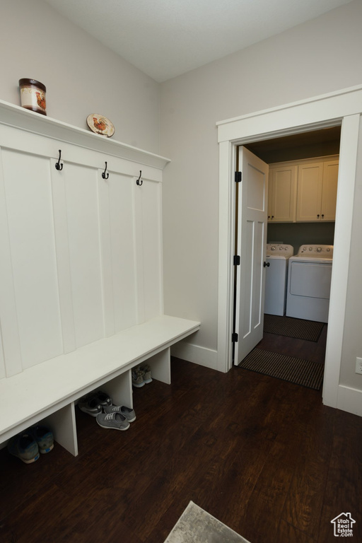 Mudroom with dark hardwood / wood-style flooring and washer and clothes dryer