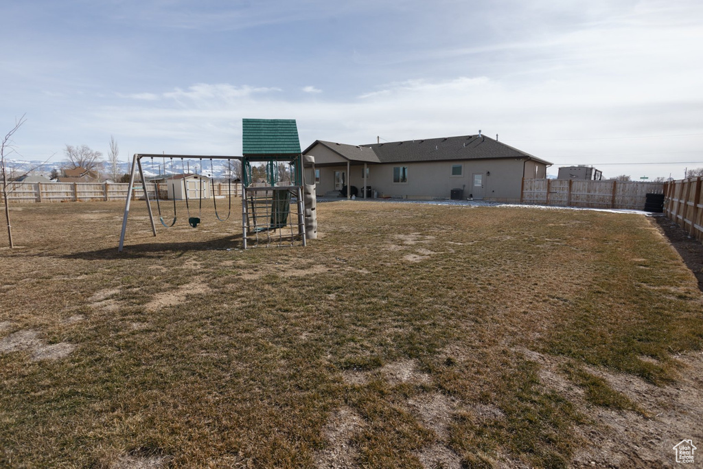 View of yard featuring a playground
