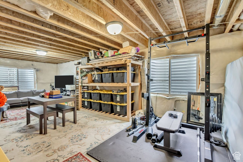 Workout room featuring concrete flooring