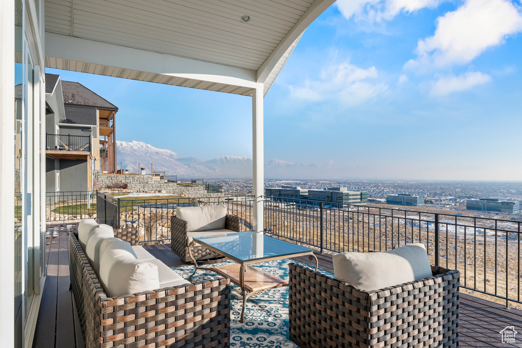 Balcony with an outdoor living space and a mountain view