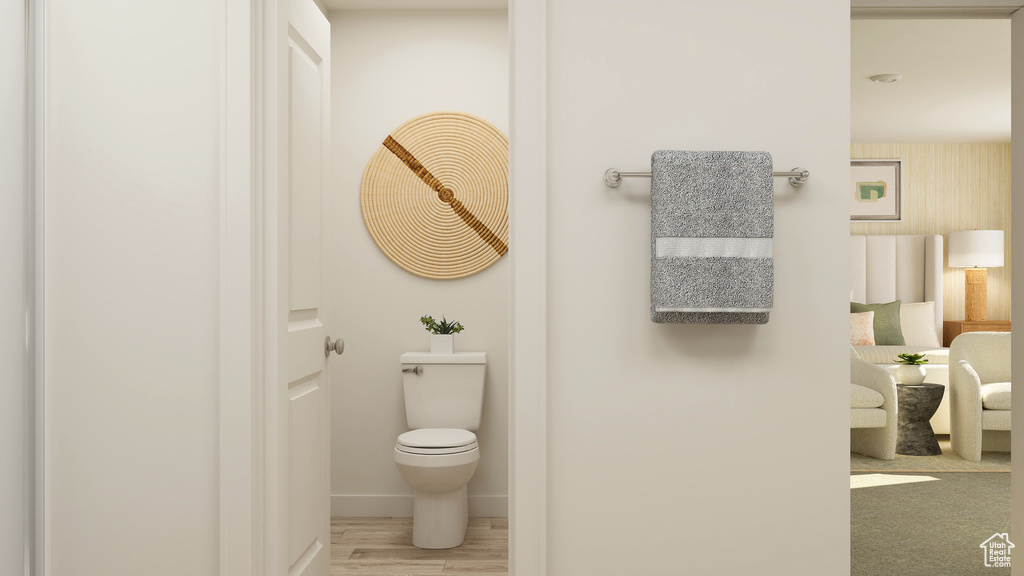 Bathroom with hardwood / wood-style floors and toilet
