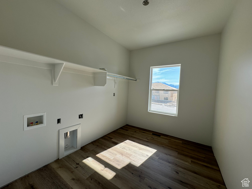 Laundry room with washer hookup and dark hardwood / wood-style floors