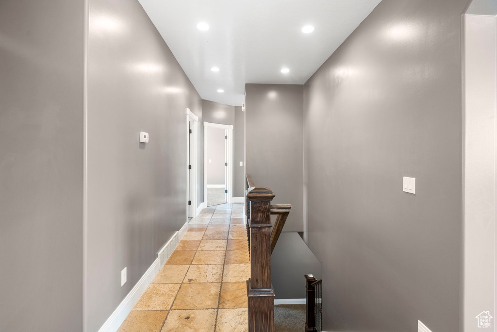 Corridor with light tile floors