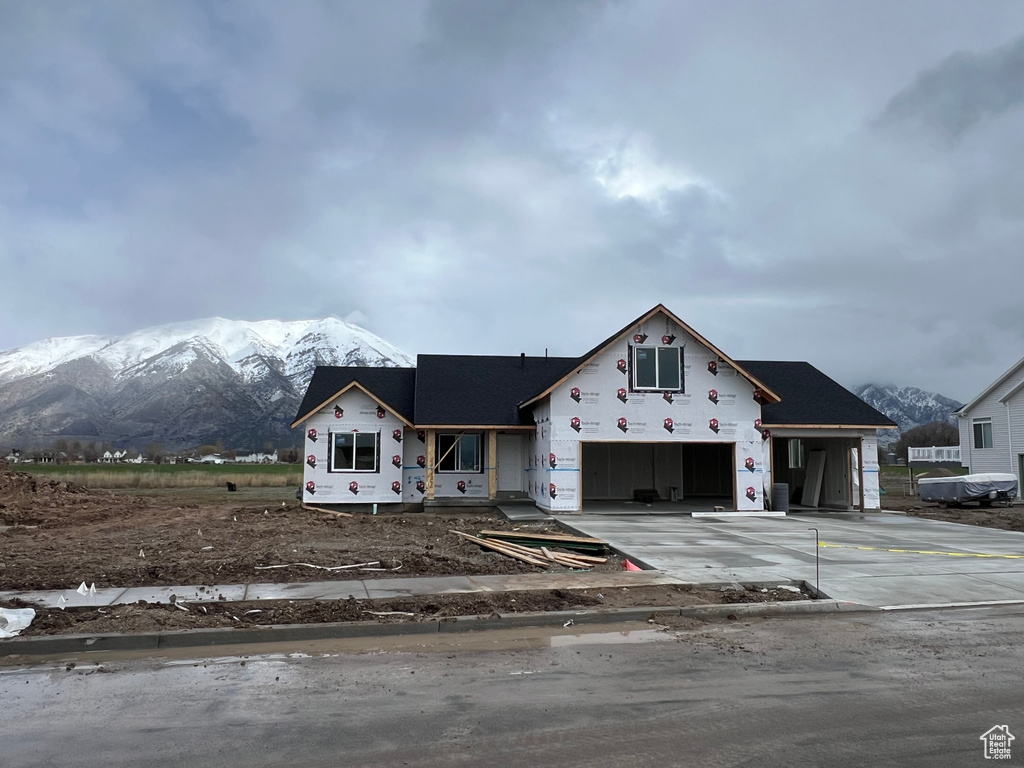 Property under construction with a mountain view