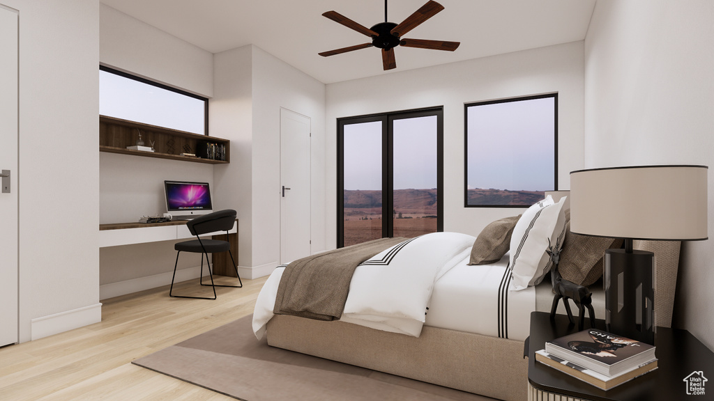 Bedroom with wood finished floors, built in desk, and a ceiling fan