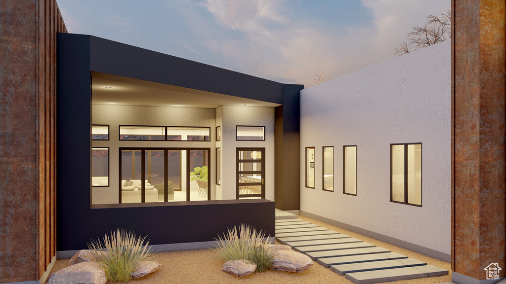 Property entrance featuring stucco siding