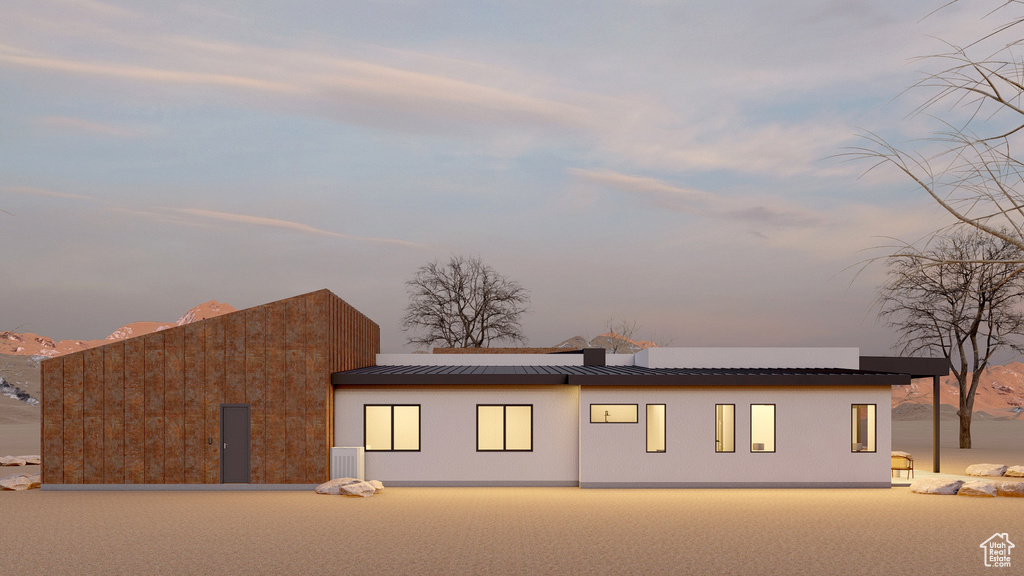View of front of home with a standing seam roof and a metal roof