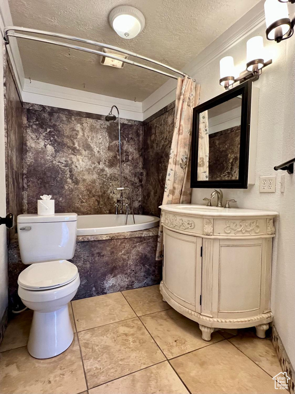 Full bathroom featuring vanity, tile floors, toilet, shower / tub combo, and crown molding