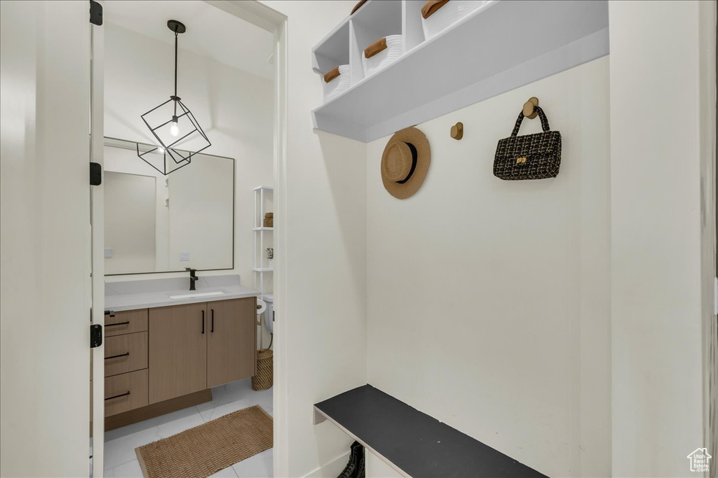 Bathroom with oversized vanity and tile floors