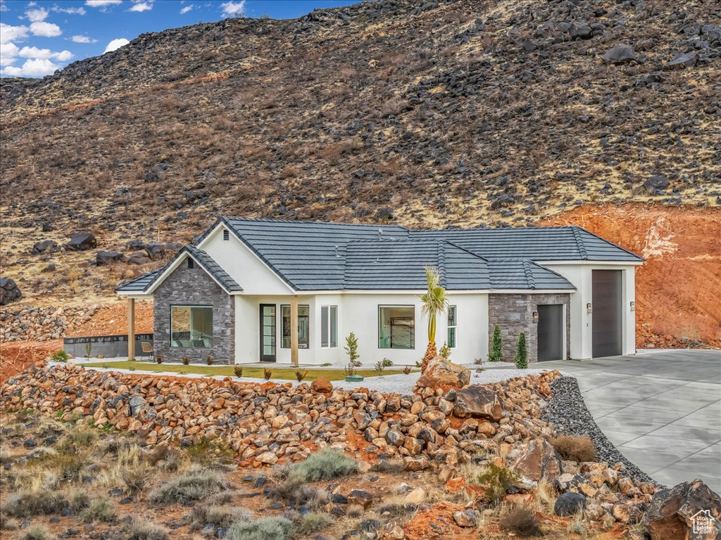 Single story home featuring a garage