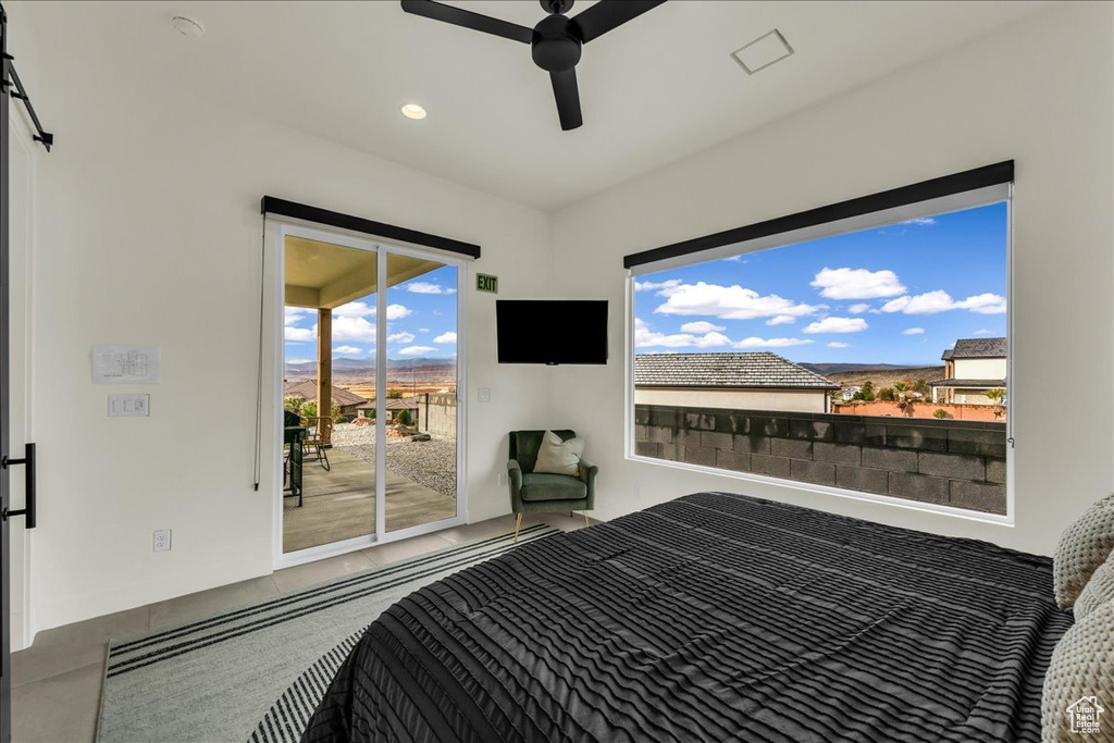 Bedroom with access to outside and ceiling fan