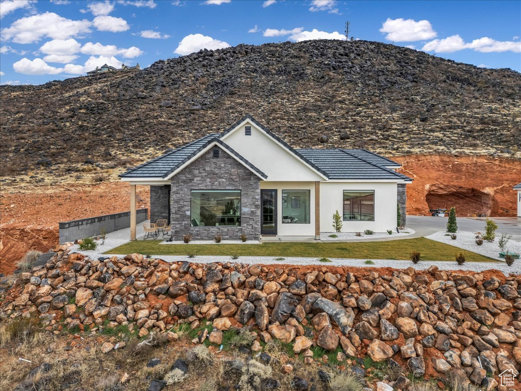 View of front of home featuring a mountain view