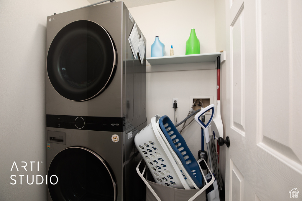 Laundry room with stacked washer / drying machine and washer hookup