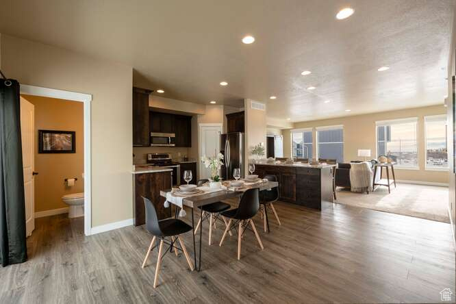 Dining space featuring light hardwood / wood-style flooring